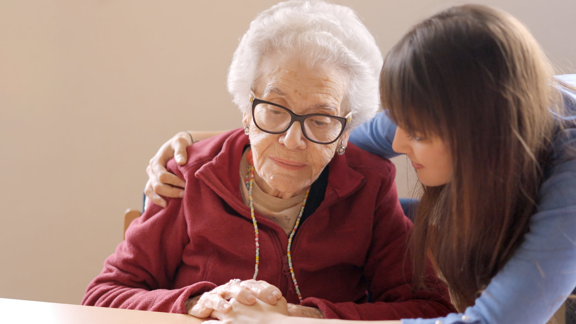 Caregiver with sad grandmother
