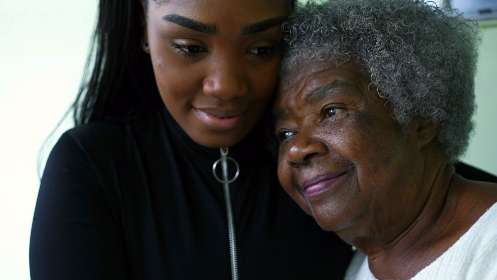 Generational black women portrait faces a grandmother and granddaughte