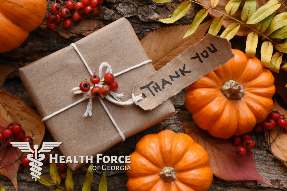 Thank you on a package and the Health Force of Georgia logo with pumpkins.